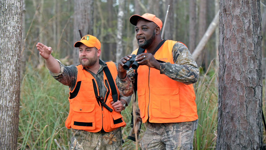 two hunters in woods