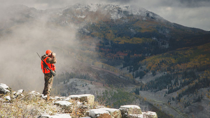 Hunter glassing mountains 