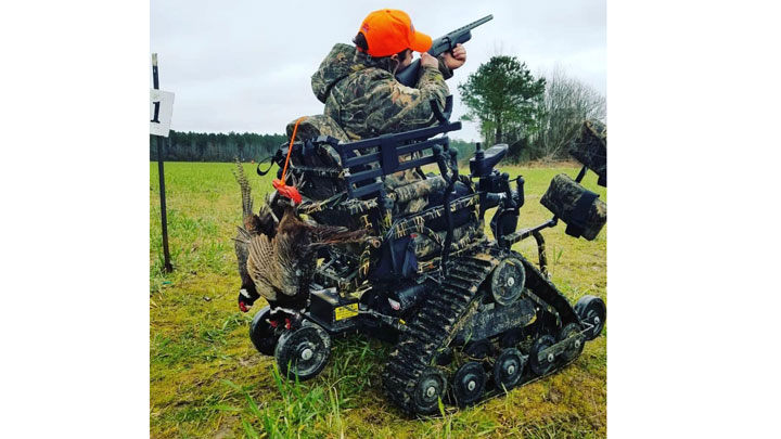 veteran hunts from a track chair