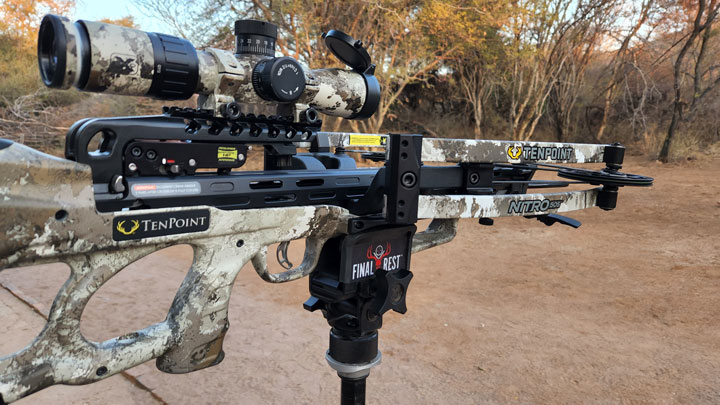 a tenpoint crossbow is mounted in a tripod saddle rest