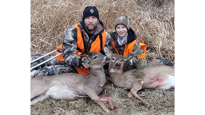 Caleb Clark and his son, Ethan, with does they took during the benefit hunt