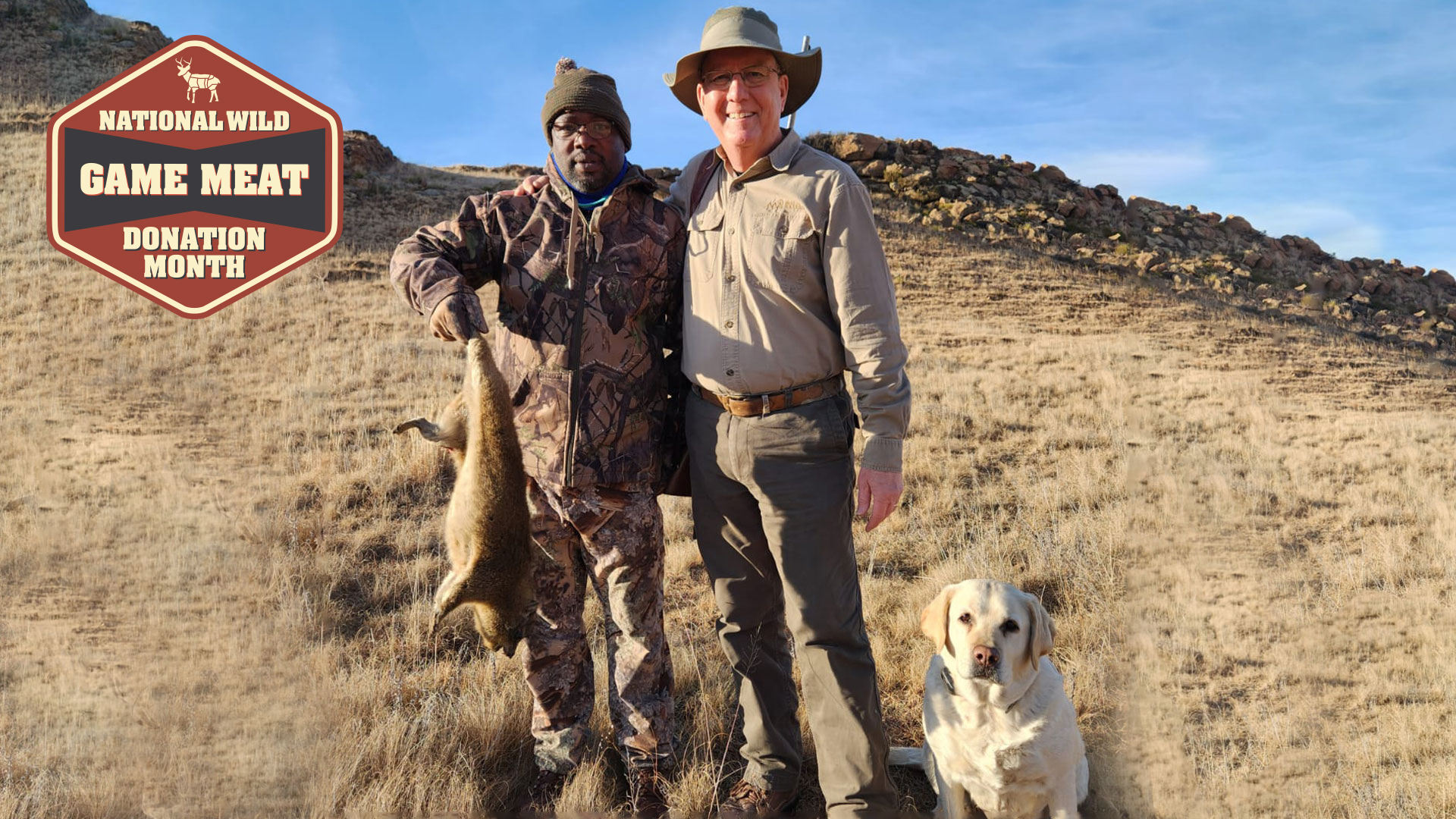 author Mike Arnold and tracker Vusi pose with a dassie taken by the author