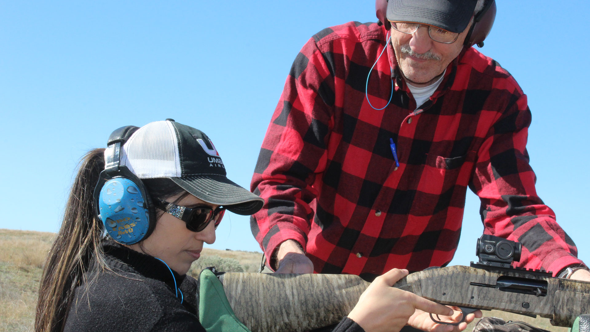 Author Tom Claycomb helps an airgun shooter.